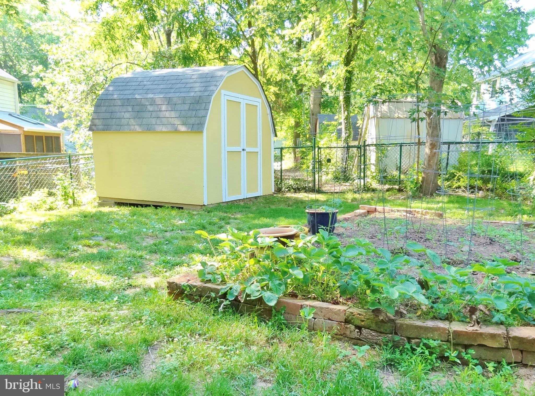 11 Hillside Road, Unit E Greenbelt, MD 20770 - Photo 4 of 11 Fenced backyard w/garden and shed