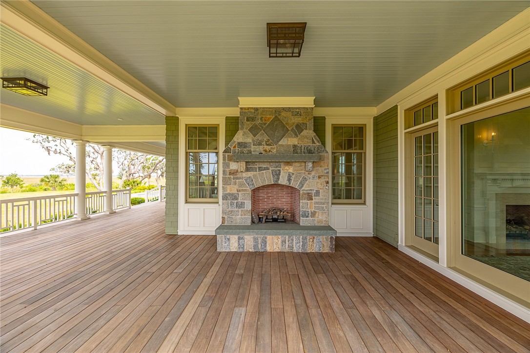 144 Point Lane St. Simons Island, GA 31522 - Photo 20 of 100 outdoor fireplace located off the library. views of Sea Island Golf Course and Sidney Lanier bridge