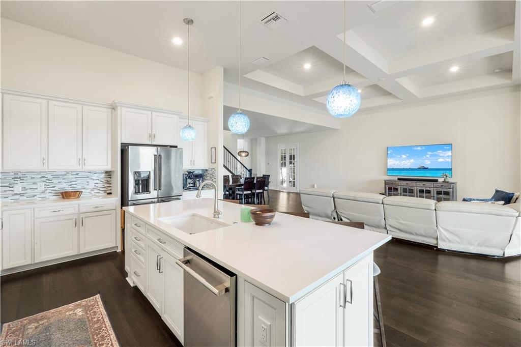 19696 Aqua View Lane Fort Myers, FL 33913 - Photo 12 of 49 a kitchen that has a lot of cabinets a sink and a stove in it