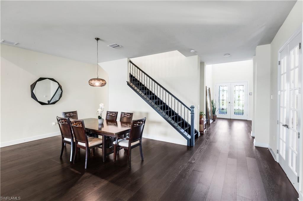 19696 Aqua View Lane Fort Myers, FL 33913 - Photo 15 of 49 a view of a dining room with furniture window and wooden floor