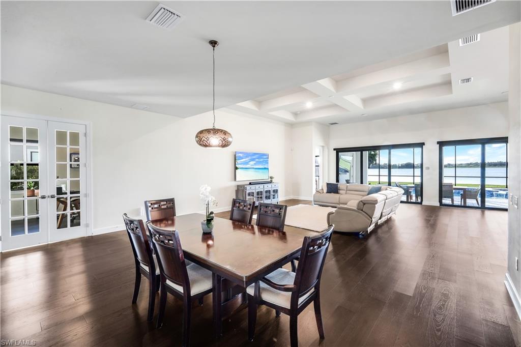 19696 Aqua View Lane Fort Myers, FL 33913 - Photo 16 of 49 a view of a dining room with furniture wooden floor and chandelier