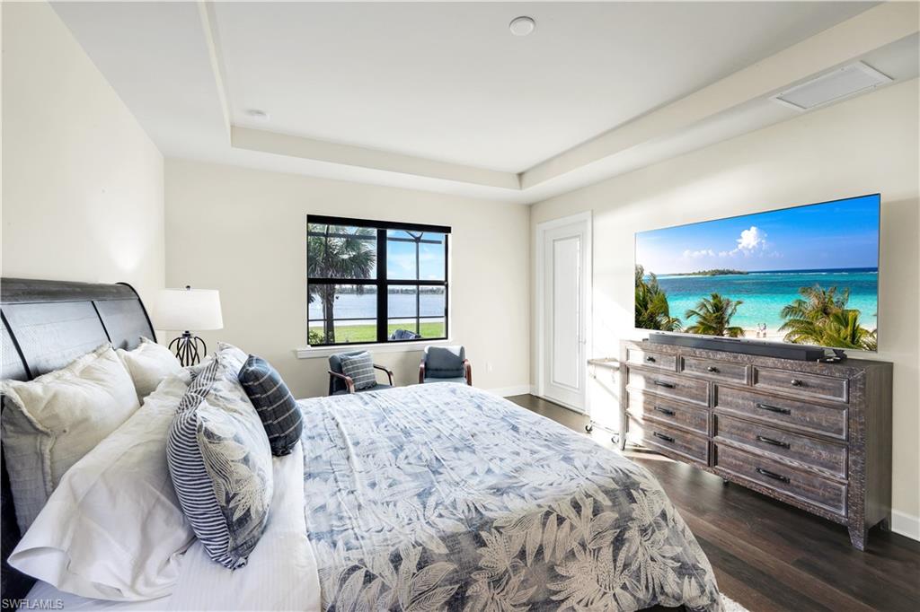 19696 Aqua View Lane Fort Myers, FL 33913 - Photo 18 of 49 a bed room with two bed and a television