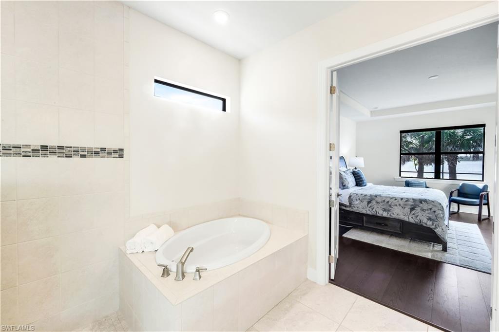 19696 Aqua View Lane Fort Myers, FL 33913 - Photo 20 of 49 a bedroom with a bed and a window