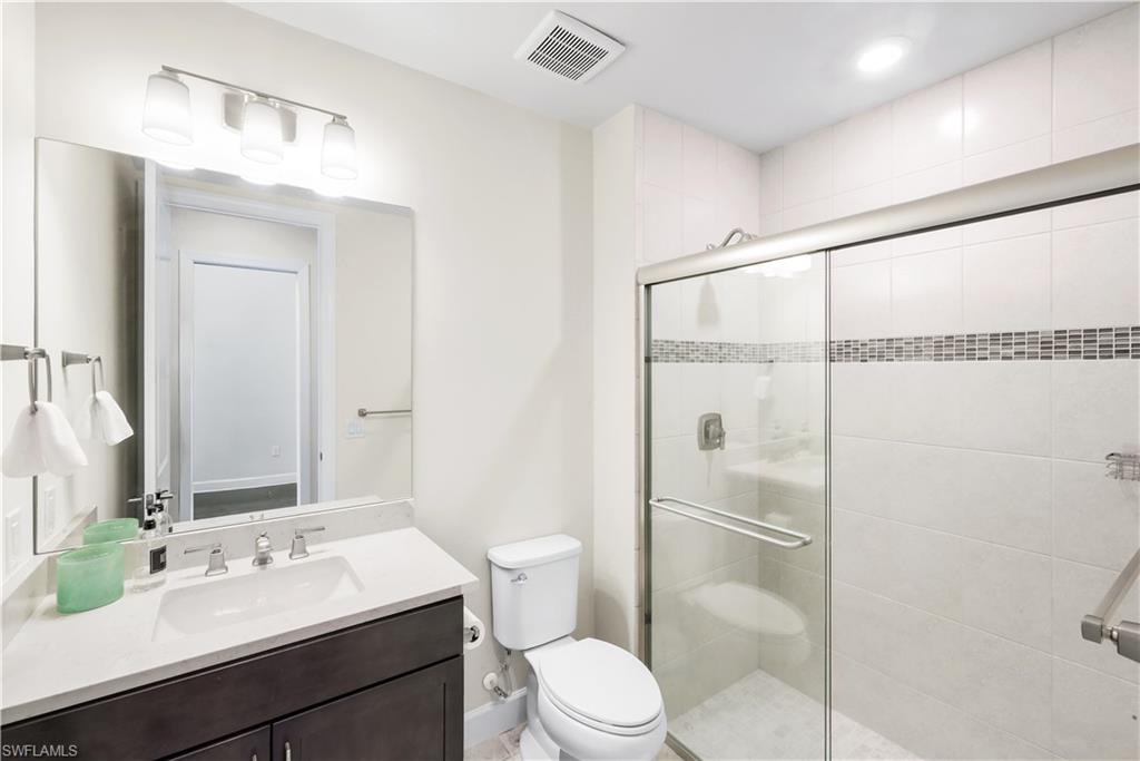 19696 Aqua View Lane Fort Myers, FL 33913 - Photo 22 of 49 a bathroom with a sink a toilet and shower