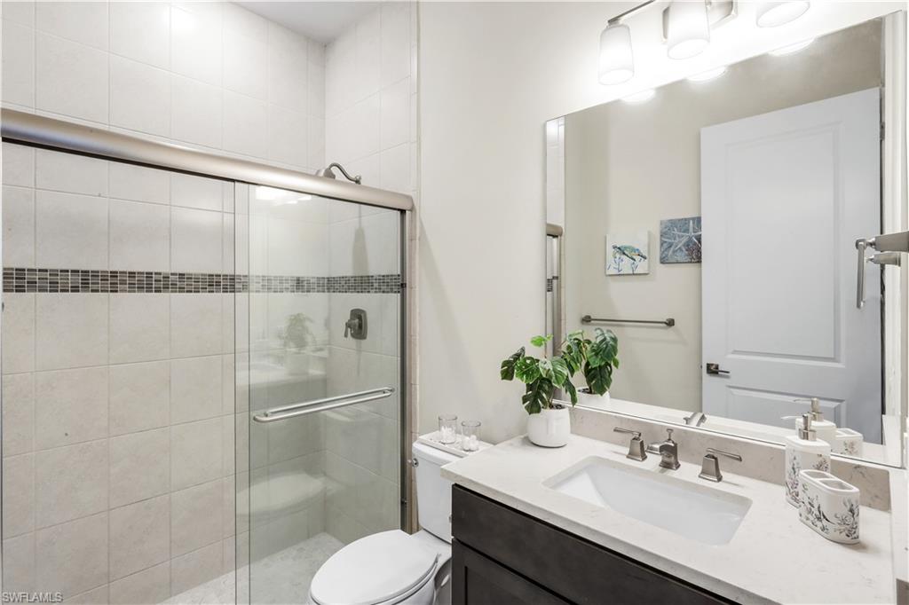 19696 Aqua View Lane Fort Myers, FL 33913 - Photo 24 of 49 a bathroom with a sink toilet and shower