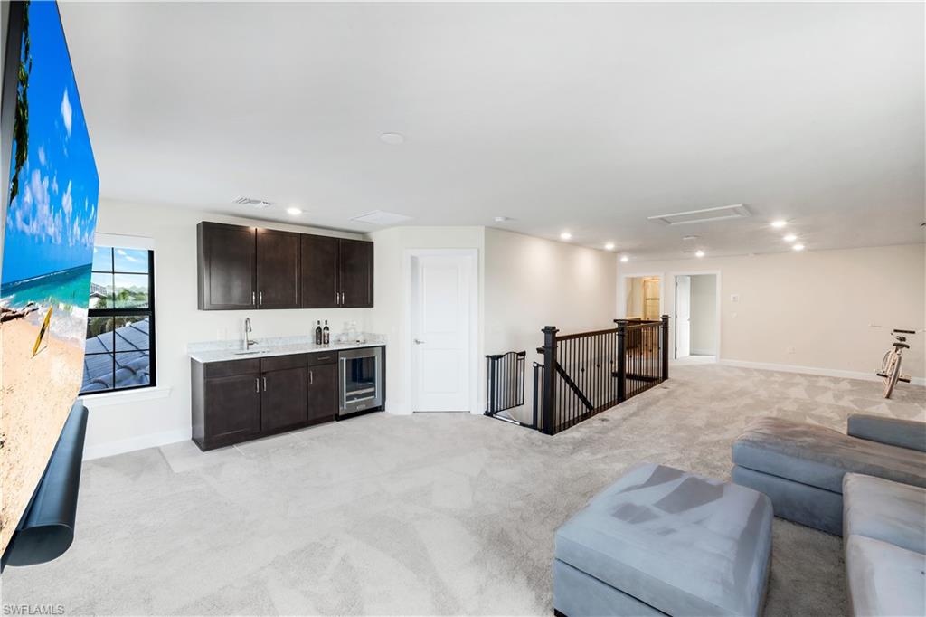 19696 Aqua View Lane Fort Myers, FL 33913 - Photo 29 of 49 a living room with furniture and a flat screen tv