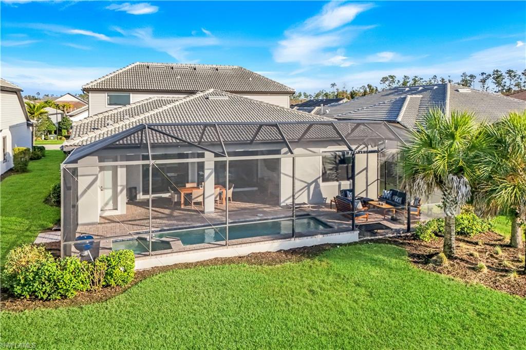 19696 Aqua View Lane Fort Myers, FL 33913 - Photo 3 of 49 a view of a house with backyard sitting area and garden