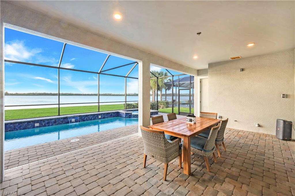 19696 Aqua View Lane Fort Myers, FL 33913 - Photo 37 of 49 a dining room with furniture and a yard
