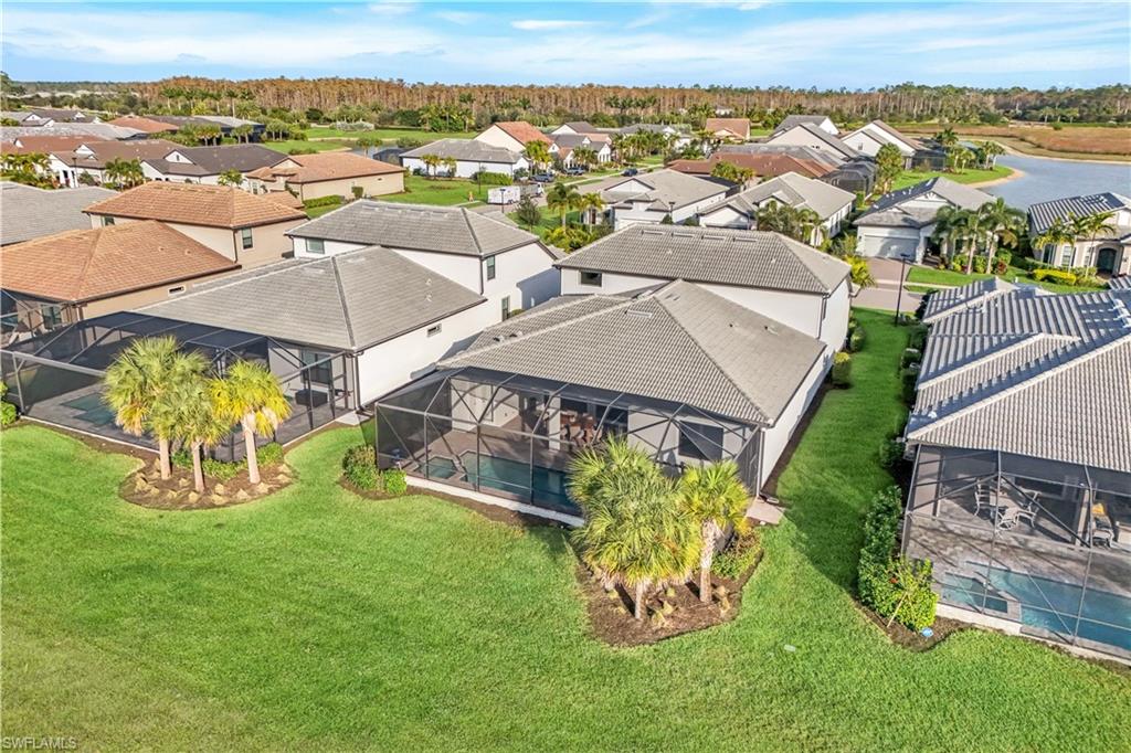 19696 Aqua View Lane Fort Myers, FL 33913 - Photo 40 of 49 an aerial view of a house with garden space and ocean view