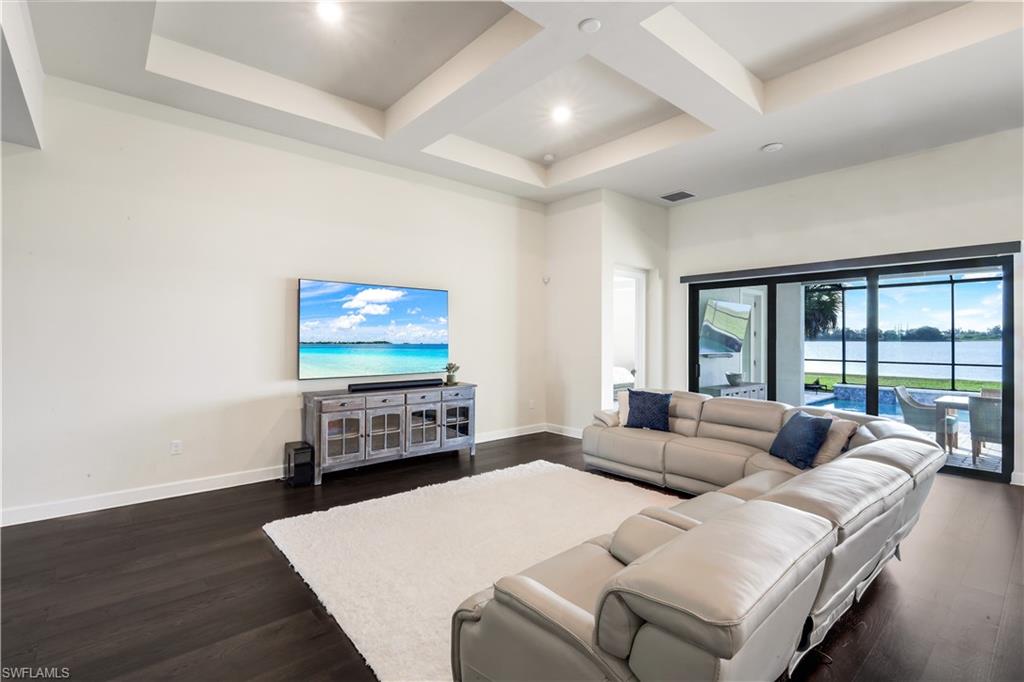 19696 Aqua View Lane Fort Myers, FL 33913 - Photo 7 of 49 a living room with furniture and a flat screen tv