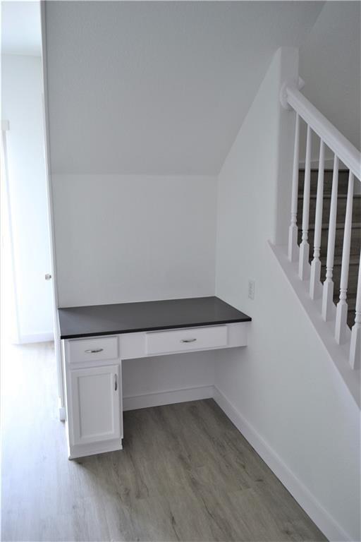 1327 Solitaire Round Rock, TX 78665 - Photo 4 of 9 a view of an empty room with wooden floor