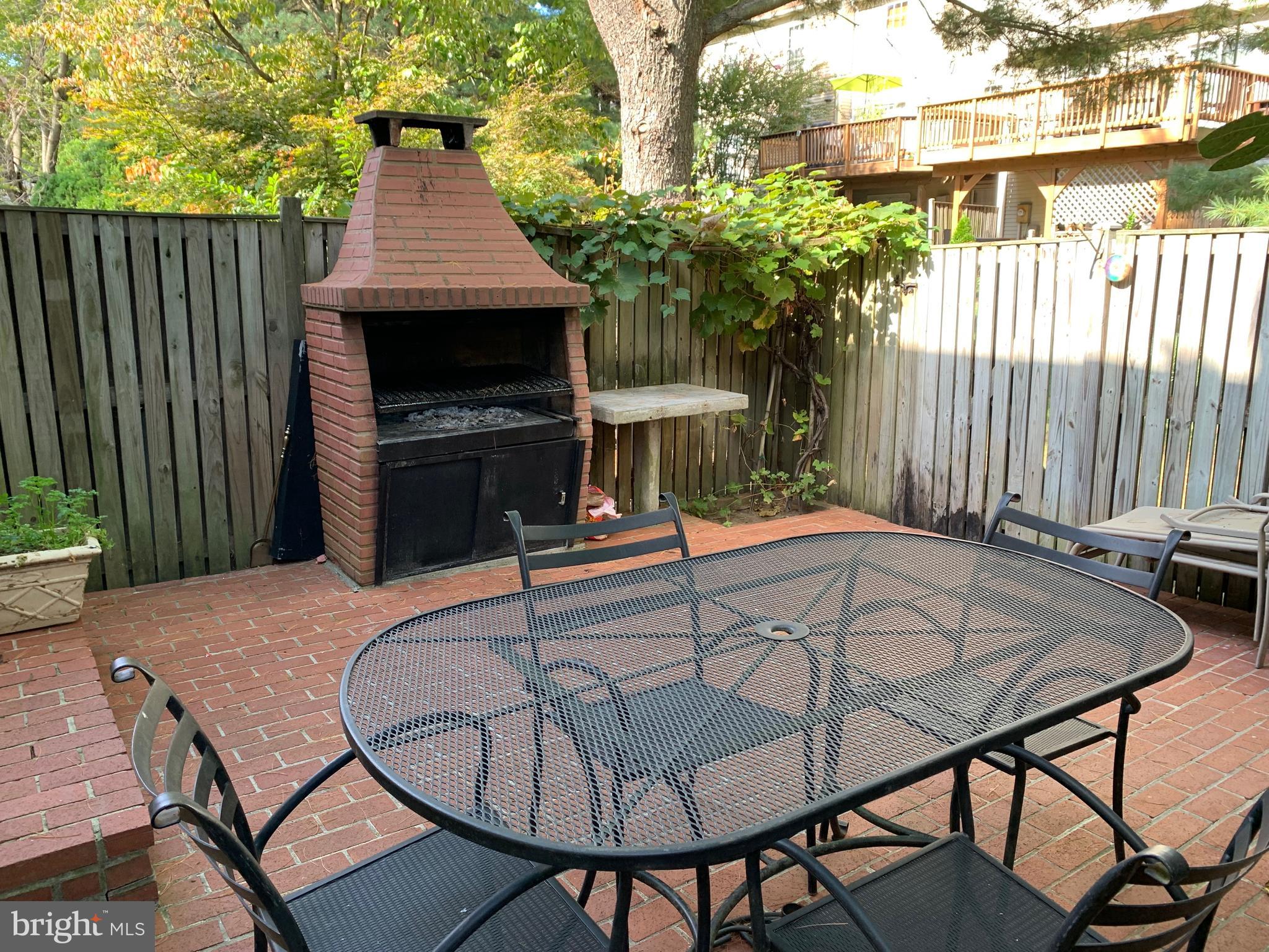 15030 Shamrock Ridge Road Silver Spring, MD 20906 - Photo 19 of 21 Beautiful Fenced Brick Patio with Brick Barbcue