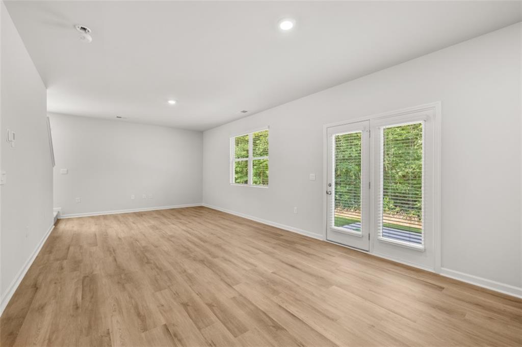 503 Oak View Lane Dallas, GA 30157 - Photo 13 of 42 wooden floor in an empty room with a window