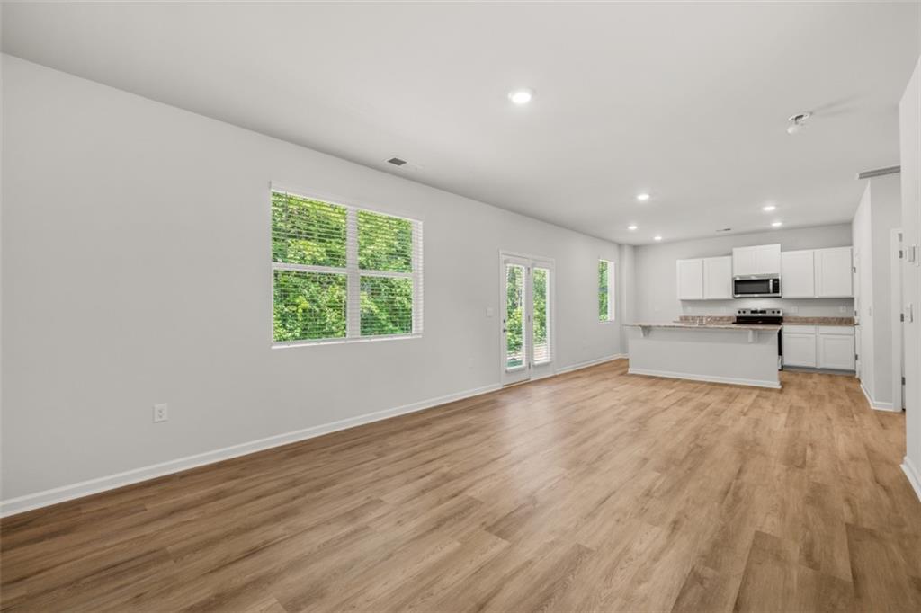 503 Oak View Lane Dallas, GA 30157 - Photo 15 of 42 a view of kitchen with wooden floor and window