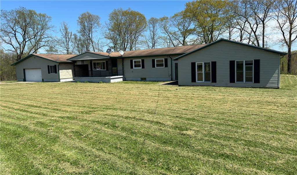 308 Sgros Road Rural Valley, PA 16249 - Photo 1 of 25 a front view of a house with yard and trees