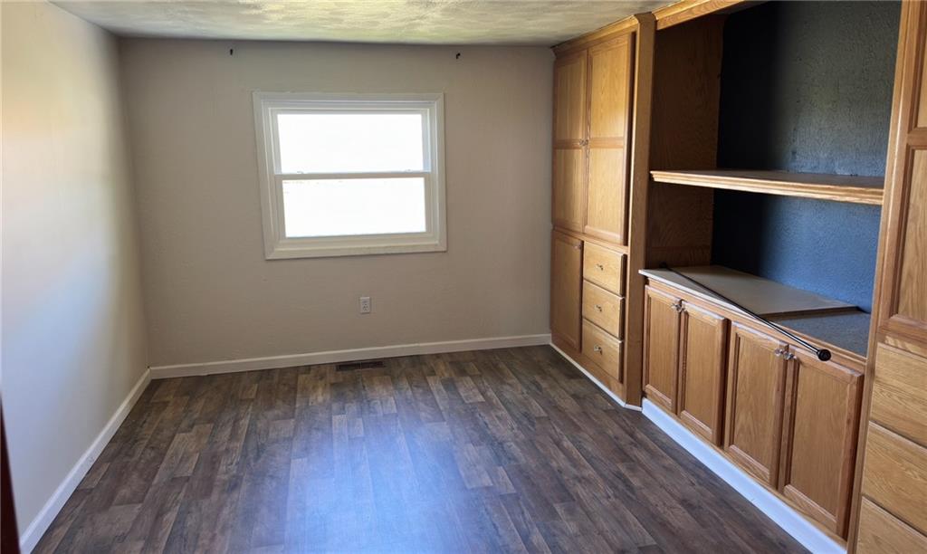 308 Sgros Road Rural Valley, PA 16249 - Photo 13 of 25 a view of an empty room with wooden floor and a window