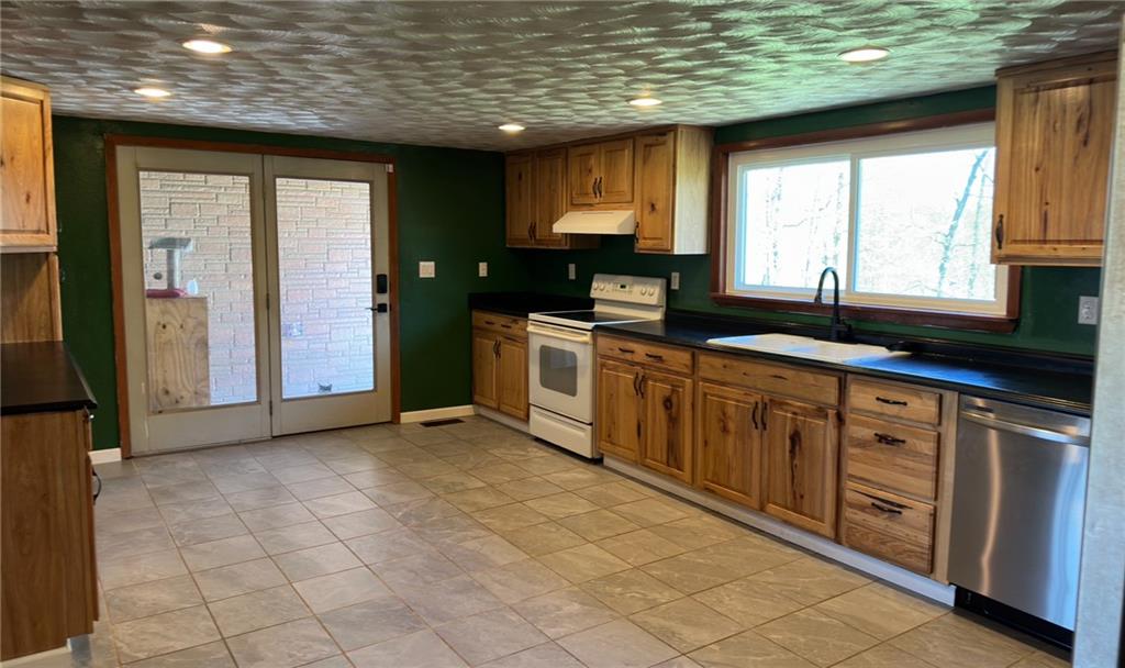 308 Sgros Road Rural Valley, PA 16249 - Photo 7 of 25 a kitchen with stainless steel appliances granite countertop a stove a sink and a granite counter tops