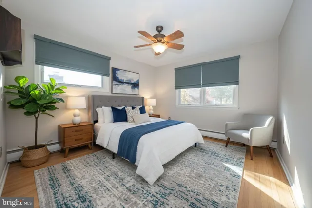 a bed room with a bed and a chandelier