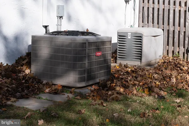 a view of a yard with a house in the background