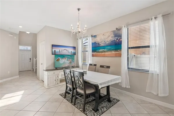 a view of a dining room with furniture window and outside view