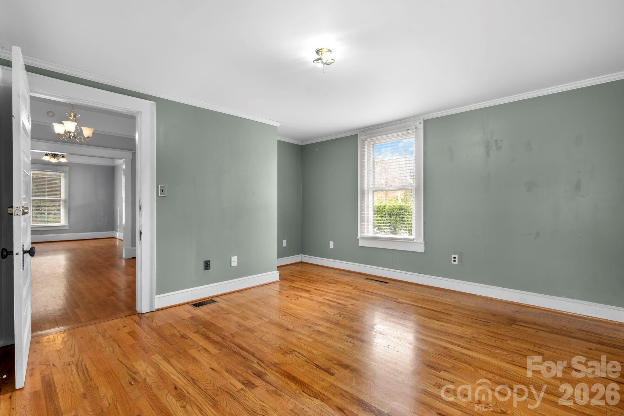925 12th Avenue Northwest Hickory, NC 28601 - Photo 10 of 19 a view of empty room with wooden floor and fan