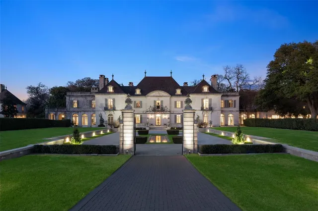 a front view of a house with swing and a garden
