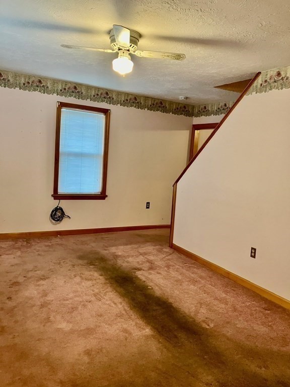 23 Carver Street Worcester, MA 01604 - Photo 13 of 27 a view of a room with a ceiling fan