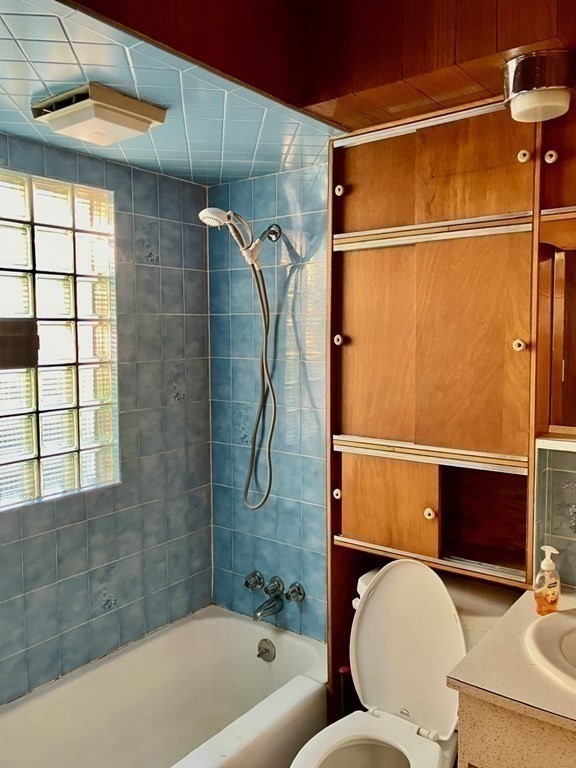 23 Carver Street Worcester, MA 01604 - Photo 16 of 27 a bathroom with a sink toilet and shower