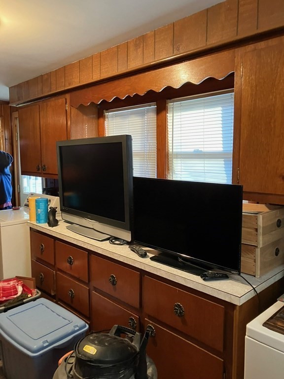 23 Carver Street Worcester, MA 01604 - Photo 18 of 27 a room with wooden floor and flat screen tv