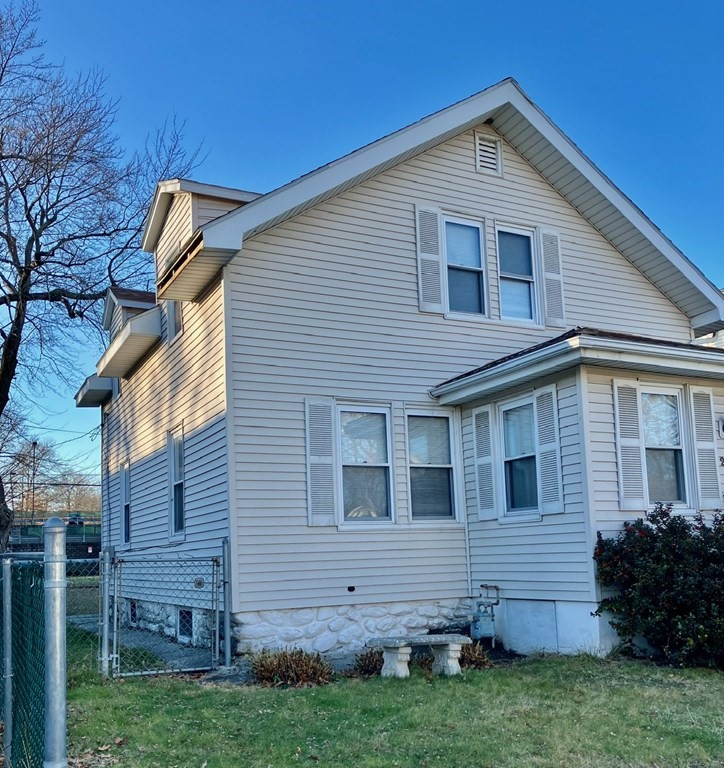 23 Carver Street Worcester, MA 01604 - Photo 2 of 27 a front view of a house with a garden