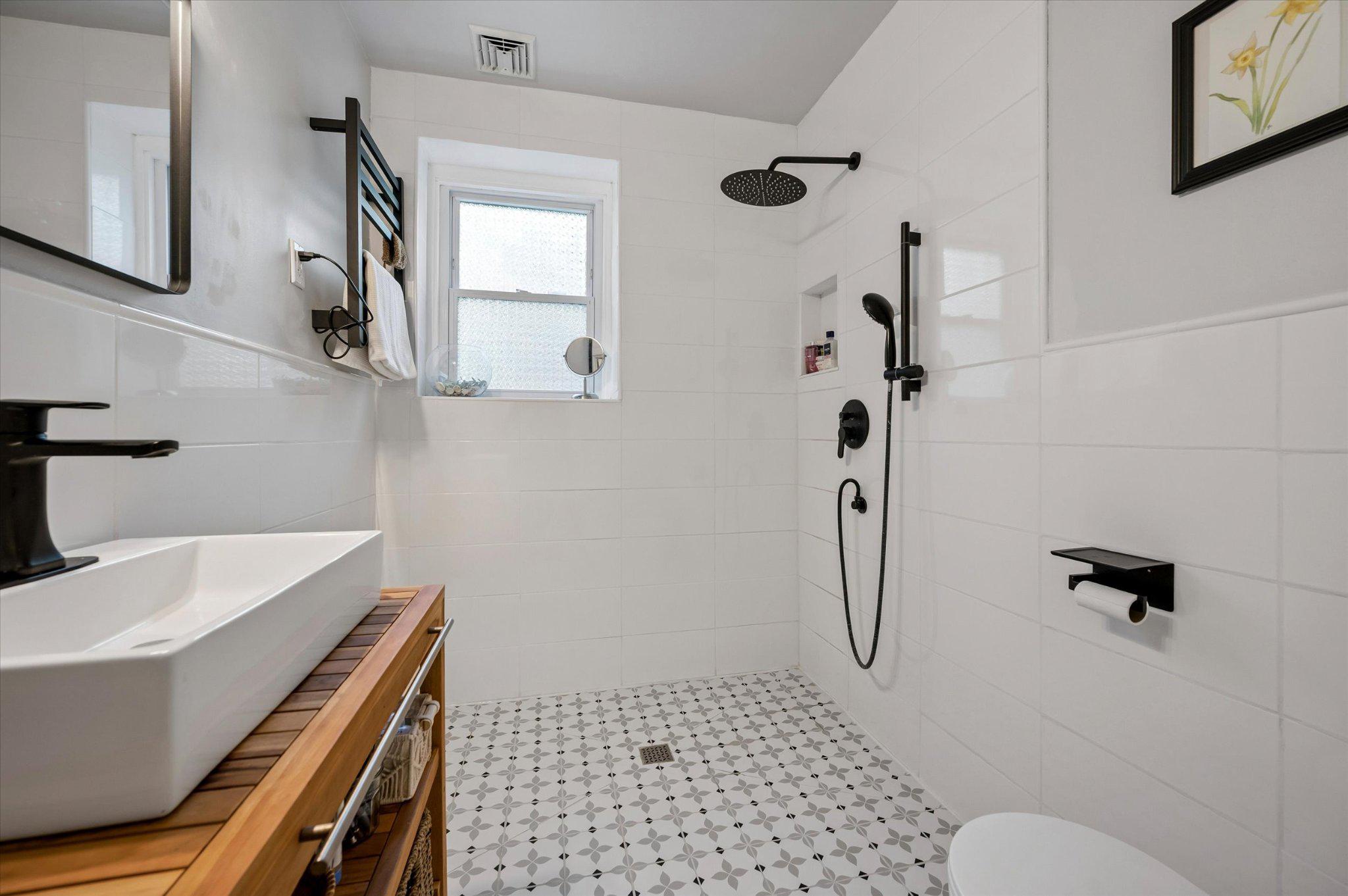 24 McCloskey Road Flourtown, PA 19031 - Photo 15 of 25 1st floor sleek bathroom with elegant tiles.