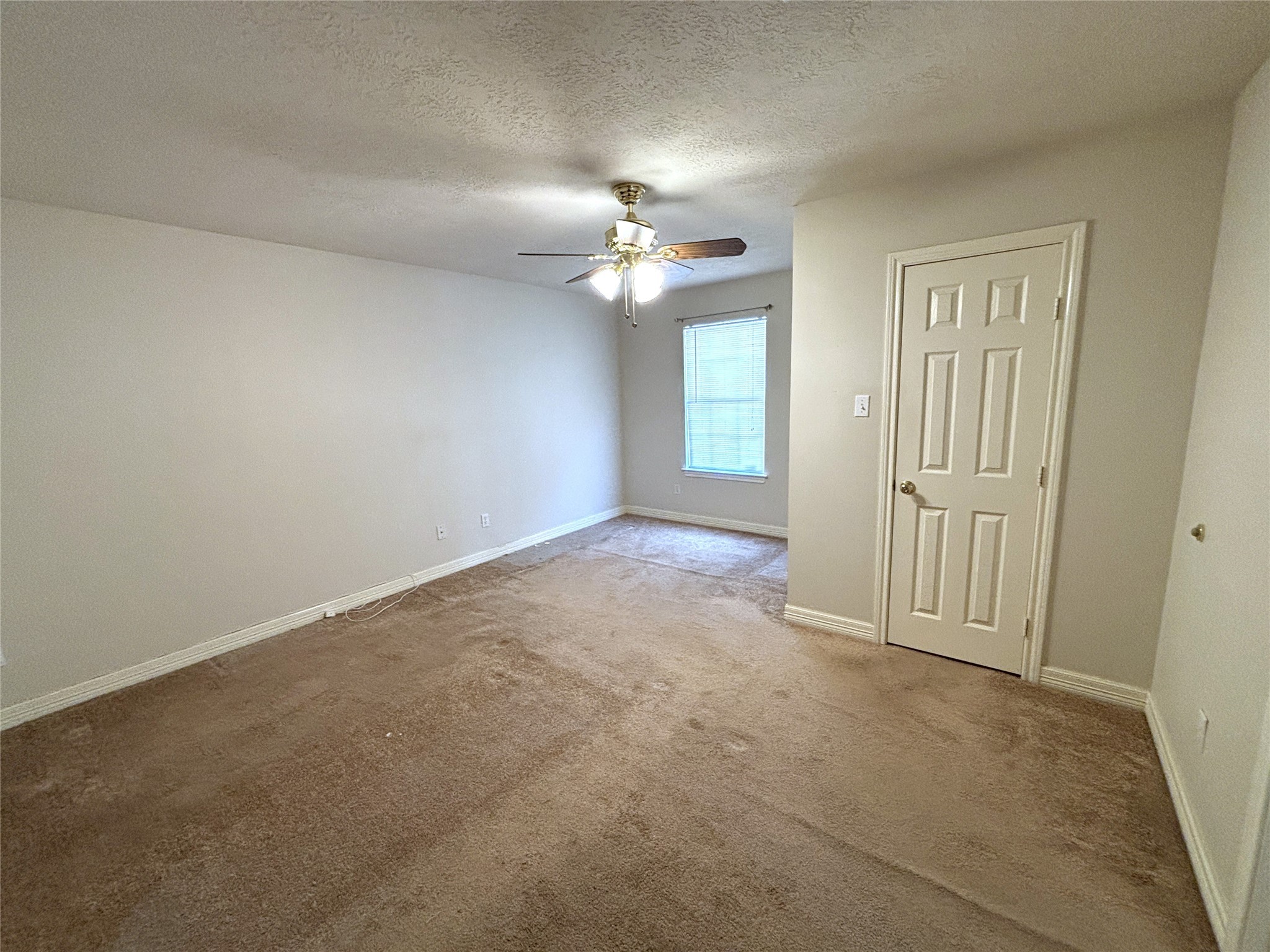 9329 Intervale Street Houston, TX 77075 - Photo 6 of 11 an empty room with chandelier fan