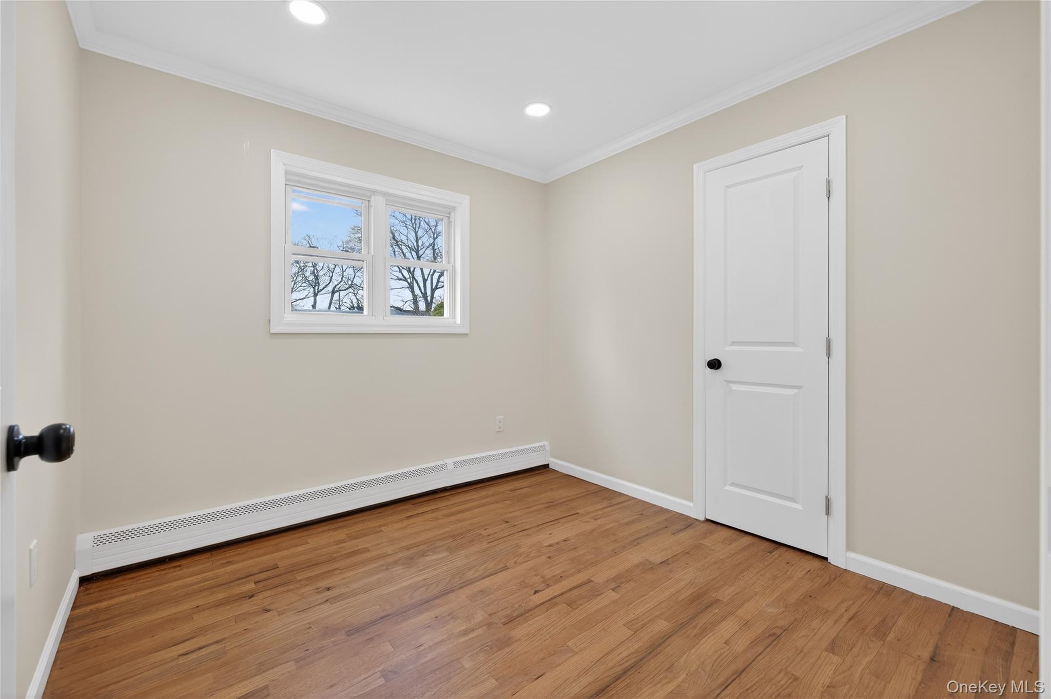 15 Lindsay Street Huntington, NY 11743 - Photo 13 of 23 a view of an empty room with wooden floor