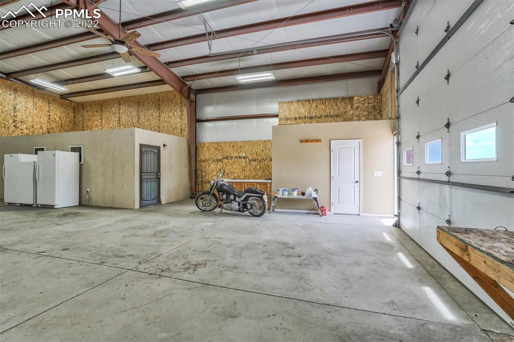 14335 Jones Road Peyton, CO 80831 - Photo 11 of 49 a view of a garage with furniture