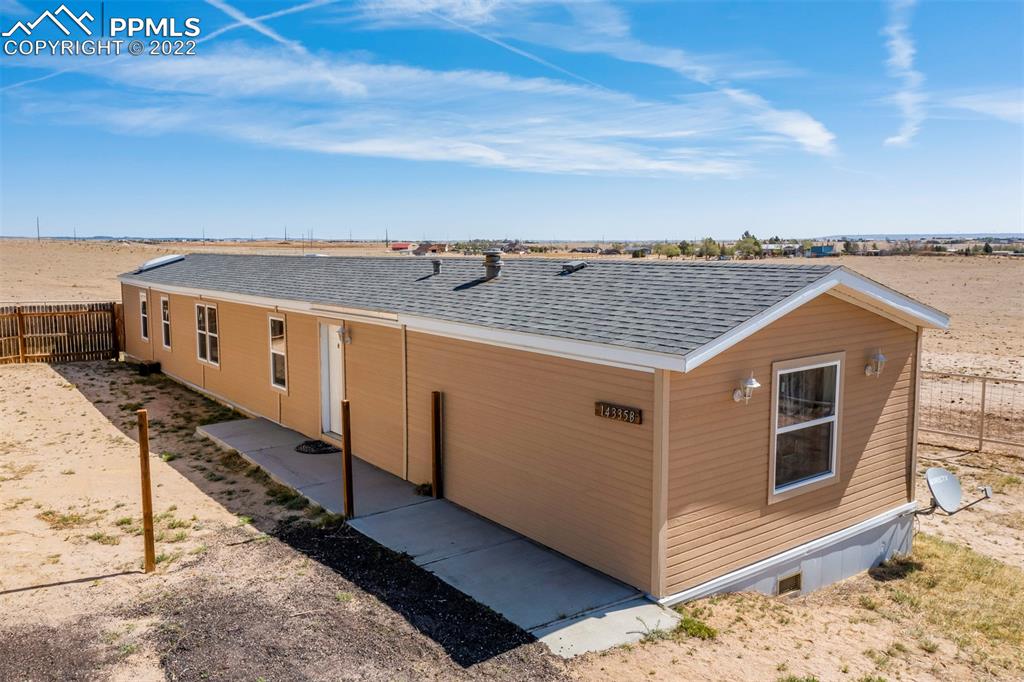 14335 Jones Road Peyton, CO 80831 - Photo 15 of 49 a view of a house with a terrace