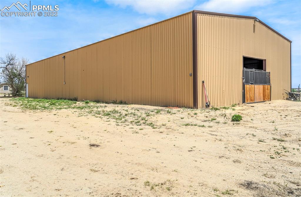14335 Jones Road Peyton, CO 80831 - Photo 17 of 49 a view of a backyard of a house