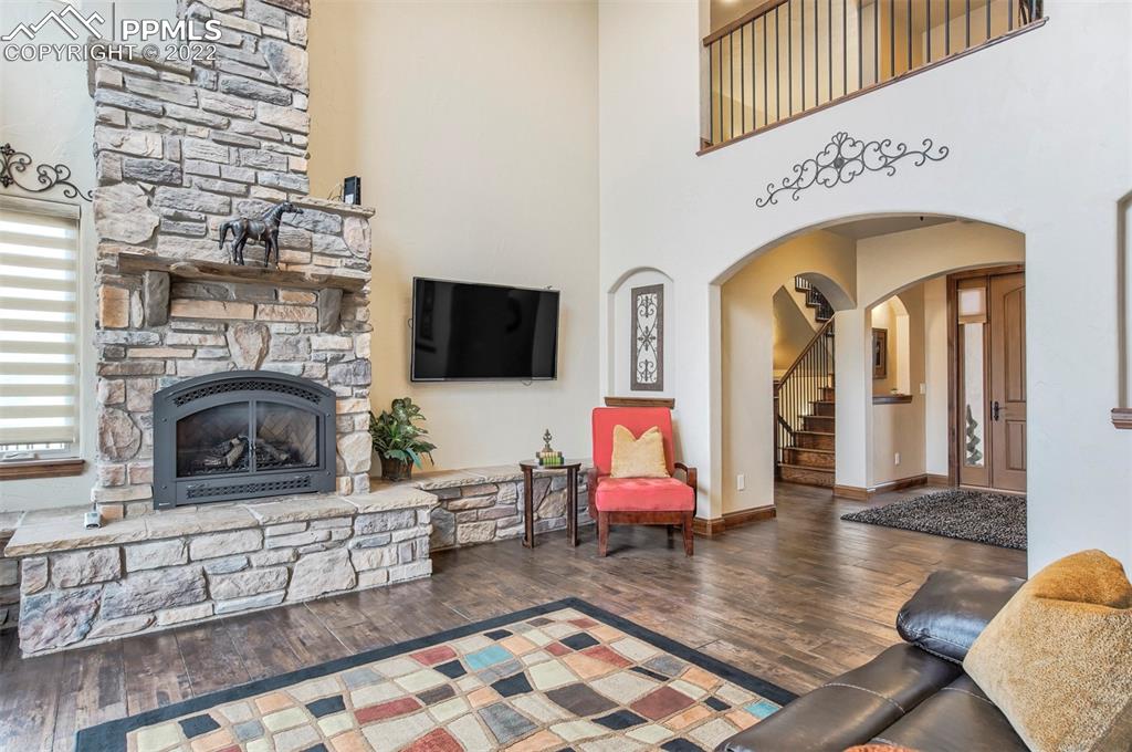 14335 Jones Road Peyton, CO 80831 - Photo 24 of 49 a living room with furniture and a fireplace