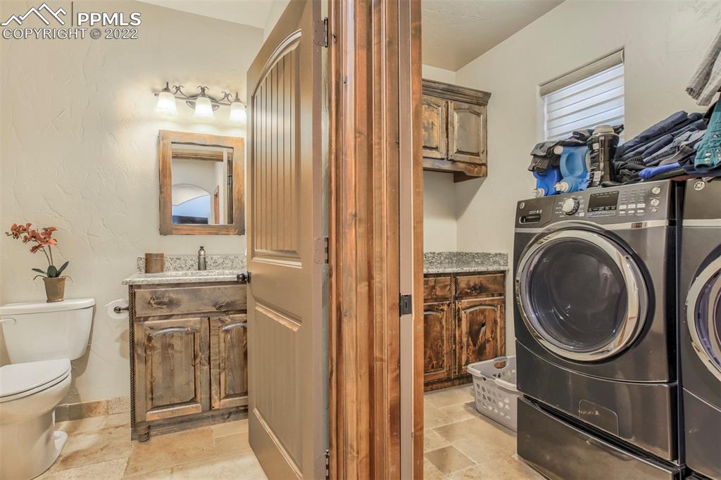 14335 Jones Road Peyton, CO 80831 - Photo 33 of 49 a bathroom with a sink toilet and shower