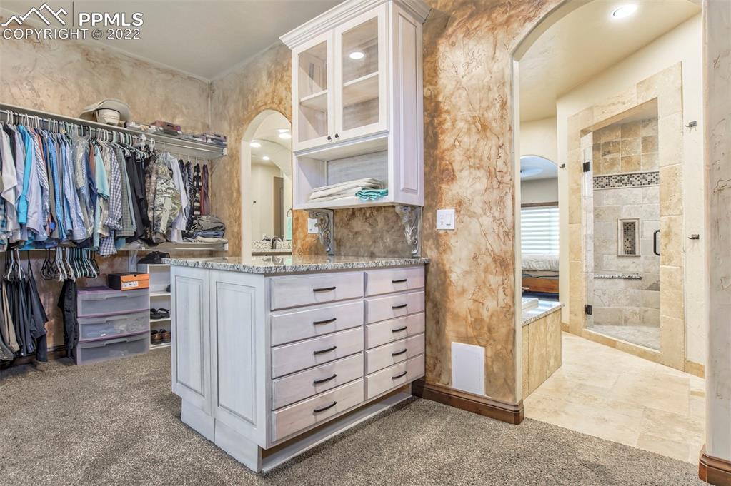 14335 Jones Road Peyton, CO 80831 - Photo 34 of 49 a view of walk in closet and bedroom