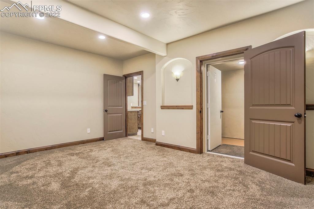 14335 Jones Road Peyton, CO 80831 - Photo 45 of 49 an empty room with closet and wooden door