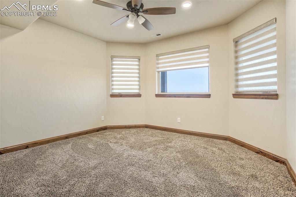 14335 Jones Road Peyton, CO 80831 - Photo 47 of 49 an empty room with a window and a fan