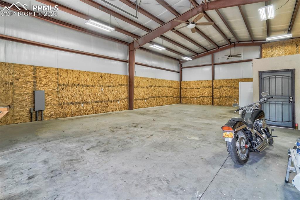 14335 Jones Road Peyton, CO 80831 - Photo 10 of 49 a view of garage with furniture
