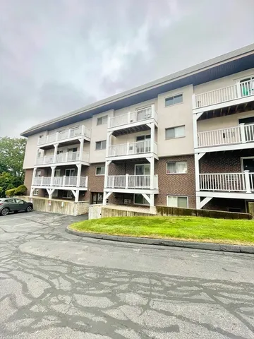 a view of building with door and ocean view