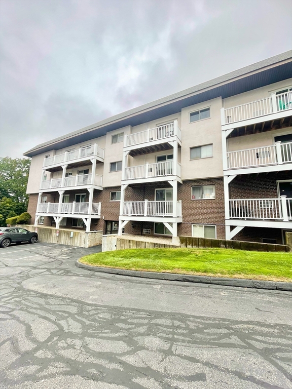 195 Independence Avenue, Unit 118 Quincy, MA 02169 - Photo 1 of 15 a view of building with door and ocean view