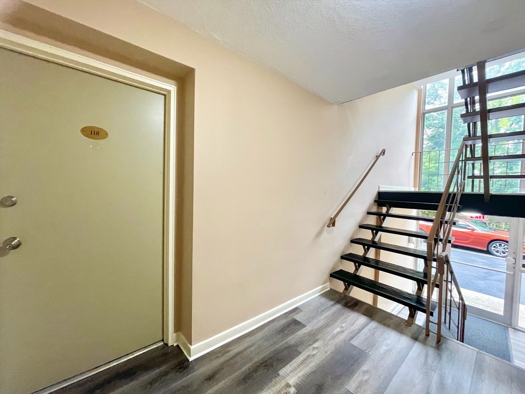 195 Independence Avenue, Unit 118 Quincy, MA 02169 - Photo 4 of 15 a view of entryway with stairs and wooden floor