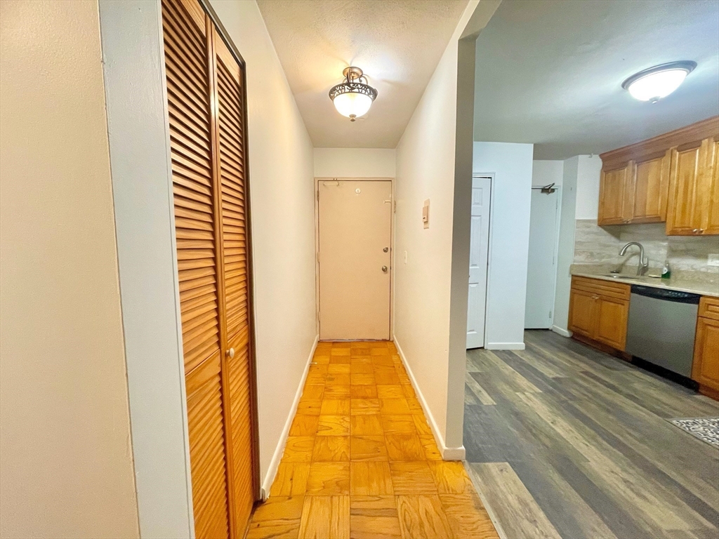 195 Independence Avenue, Unit 118 Quincy, MA 02169 - Photo 8 of 15 a view of a kitchen from the hallway