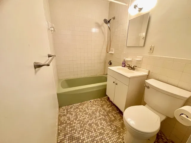 a bathroom with a toilet a sink and a bathtub