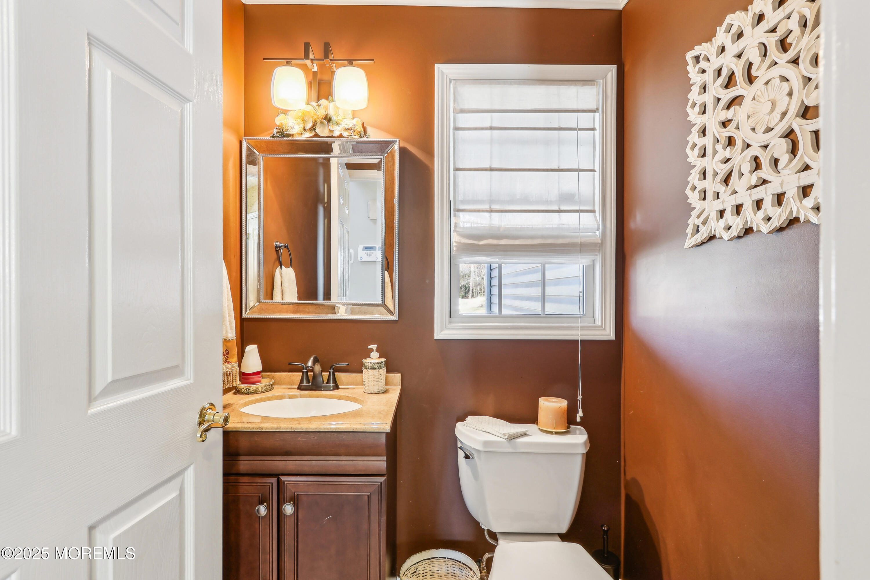 749 Rabbit Run Brick, NJ 08724 - Photo 15 of 43 a bathroom with a toilet sink and mirror