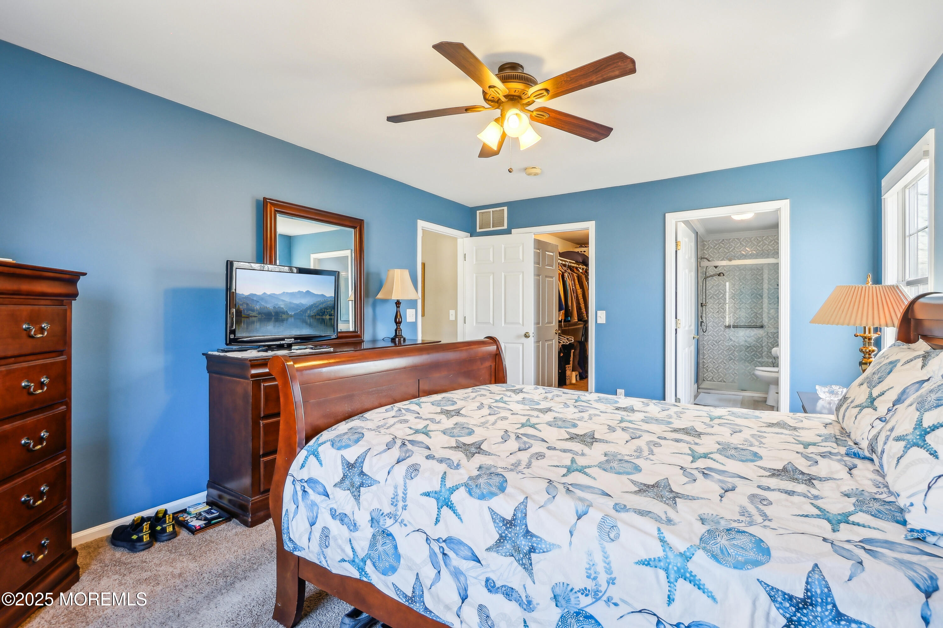 749 Rabbit Run Brick, NJ 08724 - Photo 18 of 43 a bedroom with a bed and a flat screen tv