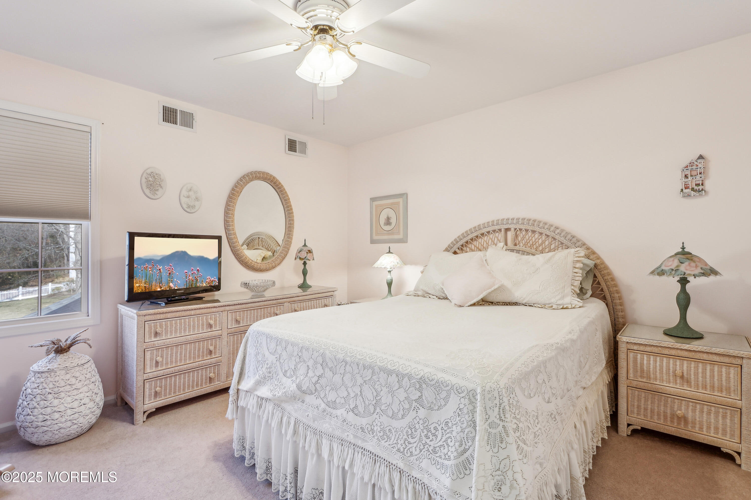 749 Rabbit Run Brick, NJ 08724 - Photo 20 of 43 a bedroom with a bed and a chandelier